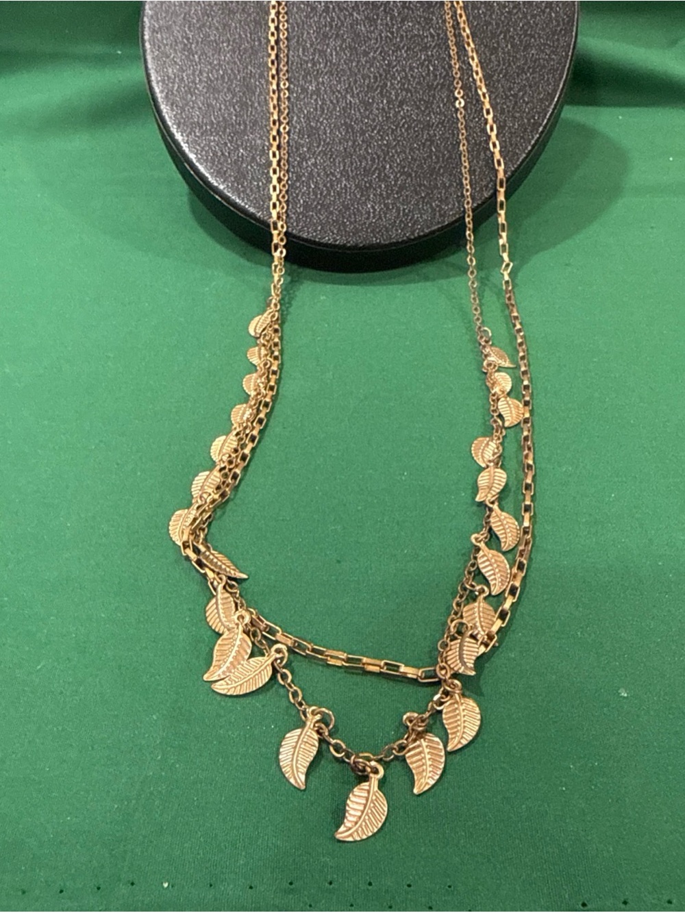 Goldtone Double Strand Chain Necklace With Small Dangling Leaf Charms. 94F
